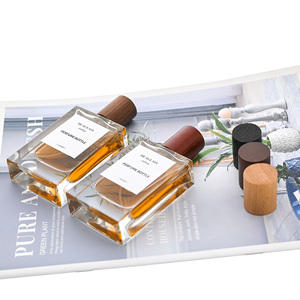 Flacon de parfum vide en gros à bas <span class=keywords><strong>prix</strong></span> 30ml 50ml 100ml avec pulvérisateur à sertir, brume fine longue durée et capuchon en bois - Product Image 1