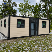 Maison conteneur modulaire préfabriquée moderne à double aile, avec auvent, fenêtre et porte vitrée, pour cabane de vacances à la plage ou au jardin, en acier extensible