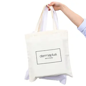 环保白色库存棉质帆布手提袋，带标志印花，用于购物集市包装肩袋