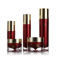 Emballage cosmétique acrylique de luxe 30ml 50ml Pots de crème transparents avec pot intérieur en goutte d'eau rouge Bouchon doré brillant