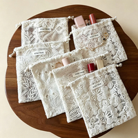 Pochette en dentelle élégante de luxe avec logo personnalisé, sac à bijoux personnalisé pour emballage cadeau de mariage, petit sac mini