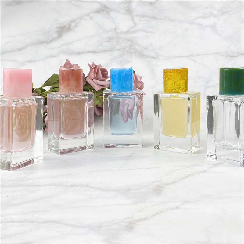 wholesale empty perfume bottles resin cap perfume bottle 50ml 70ml 100ml