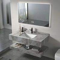 Meuble-lavabo de salle de bain double couche en marbre de luxe minimaliste avec vasque en pierre frittée et miroir intelligent pour hôtel