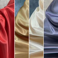 Tissu satiné cristallin polyvalent en polyester brillant pour rideaux de fond de scène de mariage et décorations multi-industrielles