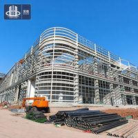 Entrepôt préfabriqué en acier avec panneaux en acier de couleur personnalisée, fabricant de bâtiments d'usine et d'ateliers à structure portique à Chongqing