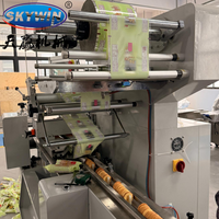 Machine d'emballage entièrement automatique pour barres énergétiques aux céréales, chocolat, biscuits, gâteaux et barres protéinées