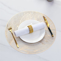 Vente en gros de sets de table ronds en PVC plastique de luxe nordique, résistants à la chaleur, style occidental, pour la décoration de table de restaurant