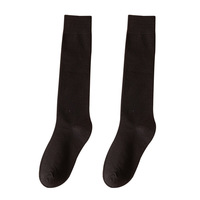 Vente en gros de chaussettes en coton pour mollet personnalisées Chaussettes demi-jambe de couleur unie Chaussettes de compression noires hautes jambes minces