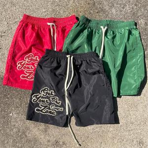 Short personnalisé pour femmes Short de gym pour femmes en nylon 100% Short coupe-vent brodé en chenille - Product Image 1