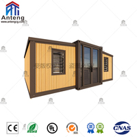 Maison conteneur extensible et pliable en bois grainé avec terrasse et auvent, 2 chambres, villa préfabriquée pour les vacances en famille et la vie en plein air
