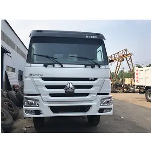 Howo 8X4 12 바퀴 60 톤은 두바이에 있는 판매를 위한 iveco isuzu 하치장 오른손 드라이브 팁 주는 사람 트럭 두바이 측 tippng 트럭 트레일러를 사용했습니다