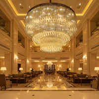 Grands lustres en cristal en acier inoxydable personnalisés avec commande par interrupteur LED pour usage intérieur, idéaux pour l'éclairage des halls d'hôtel et des salles de banquet