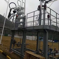 Système de chargement/déchargement liquide monté sur patins avec bras de chargement à commande par lots et escalier pliant pour l'essence