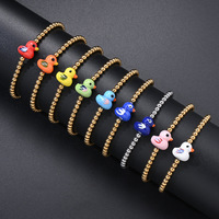 Bracelet extensible en acier inoxydable inaltérable avec perles dorées, motif animal mignon et perles en céramique colorées en forme de petit canard, pour filles