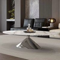 Table basse ovale moderne en marbre, petite et simple, idéale pour salon design familial