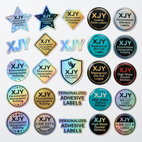 Autocollants en PVC holographiques personnalisés XJY, étiquettes en vinyle découpées avec logo et effet 3D pour l'emballage de marque