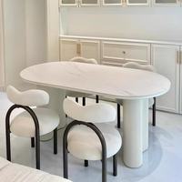 Ensemble de salle à manger ovale en pierre frittée de style crème nordique, luxe léger, table et chaises modernes minimalistes à la française pour petite maison