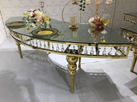 Table à manger de mariage moderne en cristal avec base en acier inoxydable en forme de lune serpentine et verre miroir