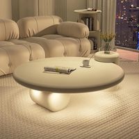 Table basse ronde style crème Voyage pour petit appartement, design artistique haut de gamme, salon moderne, design français simple pour la maison