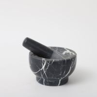Mortier et pilon en granit à prix avantageux avec un ensemble en marbre noir à utiliser en cuisine