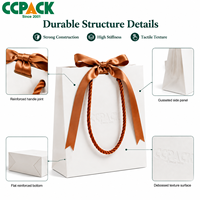 Sacs en papier kraft blanc personnalisés avec logo Ccpack, poignée tressée de luxe, ruban à nœud, emballage cadeau pour bijoux, boutique de mode