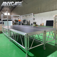 Plateforme de scène en alliage d'aluminium ANYCASE ACS-AS, hauteur réglable (0,3-1,8 m), surface antidérapante/tapis/plexiglas, certifiée TUV