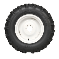 Pneu agricole en caoutchouc 130/90-21 8PR R1 à chambre à air pour terrain agricole boueux, avec crampons auto-nettoyants profonds et antidérapants pour une performance optimale en conditions de travail.