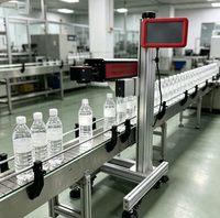 Machine de marquage laser CO2 automatique haute vitesse YAOMATEC 40W pour la date d'expiration, le code de lot et le numéro sur les sacs en plastique et les bouteilles