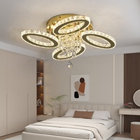 Lustre LED contemporain de luxe à 4 anneaux en cristal pour l'éclairage des hôtels et villas