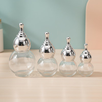 Flacon en verre transparent créatif de 50 ml en forme de gourde avec bouchon doré estampé pour huiles essentielles et essences
