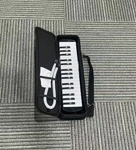 Melódica al por mayor de fábrica, 32/37 teclas, logotipo personalizado, instrumento musical de viento con caja de regalo para distribuidores escolares - Product Image 2