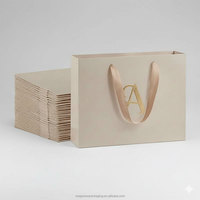 Sac en papier d'emballage pour bijoux, montres et maquillage, personnalisé et créatif, avec votre propre logo, sac cadeau de luxe à texture de pierre avec poignée en ruban