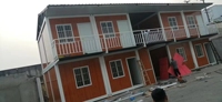 Maison modulaire à deux étages en conteneur, structure en acier imperméable, maison préfabriquée pliable pour logement temporaire des travailleurs