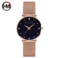 Hannah Martin Montre à cadran pailleté bleu ciel étoilé pour femme Bracelet en maille d'acier inoxydable minimaliste Seiko Quartz 1 an en alliage de verre