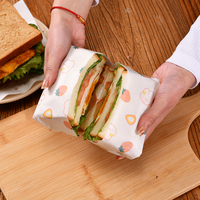 Logo personnalisé papier résistant à l'huile pour hamburger de qualité alimentaire emballage d'épicerie papier d'emballage anti-graisse frites restauration rapide papier sulfurisé