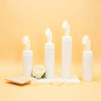 Flacon pompe en mousse PET format voyage 30ml 50ml 80ml 100ml avec brosse faciale en silicone pour nettoyant et soins de la peau