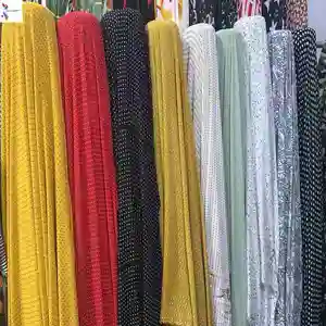 Hot selling 100% polyester woven printed chiffon bead points stock lot fabric for garment