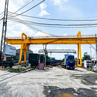 Grue portique industrielle sur pneus de 30 tonnes avec moteur et télécommande sans fil haute performance pour la construction de poutres de pont