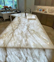 Comptoir de cuisine rétro-éclairé en marbre Onyx Fissure de glace lumineuse Comptoir de salle de bain en pierre naturelle Comptoir de réception lumineux Dessus de table