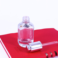 Flacon compte-gouttes en verre de luxe au design unique avec bouton poussoir pour sérum visage et huile essentielle, 1oz 2oz 30ml 50ml, avec boîte d'emballage
