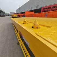 Semi-remorque plateau robuste à 2 essieux pour conteneurs multi-tailles 20/40, idéale pour le transport de machines de construction