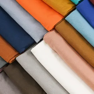 उच्च गुणवत्ता वाले स्टॉक 15 रंग 60 के दशक 170GSM थोक 100% शुद्ध सूती कपड़े परिधान के लिए मर्सराइज्ड सूती इंटरलॉक कपड़े