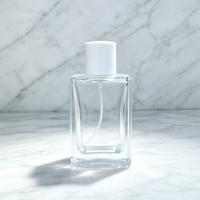Flacon de parfum de luxe en verre transparent de 100 ml, vide, rectangulaire, cosmétique, avec base lourde et capuchon cylindrique blanc