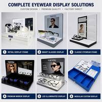 Présentoir à lunettes modulaire blanc à deux niveaux avec miroir d'essayage intégré, panneau d'affichage interchangeable et barre d'accessoires pour comptoir