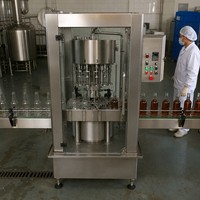 Machine de remplissage sous vide automatique à 12 têtes haute vitesse, fortement recommandée pour les usines de remplissage de bouteilles