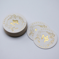 Autocollants d'étiquette en papier de coton mat texturé en feuille d'or gaufrée de luxe personnalisés pour l'emballage