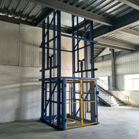 Plateforme élévatrice verticale industrielle fixe sur rail de guidage personnalisé pour entrepôt d'usine