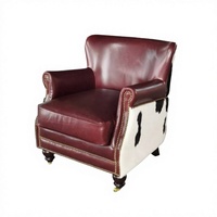 Fauteuil en cuir de vachette noir et blanc de style européen, cuir véritable, structure en bois massif, fauteuil luxueux à une place, mobilier d'intérieur, chaise confortable