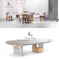 Table à manger de luxe en marbre, base métallique unique, plateau ovale en pierre, taille personnalisée, mobilier de salle à manger pour villa, décoration artistique moderne