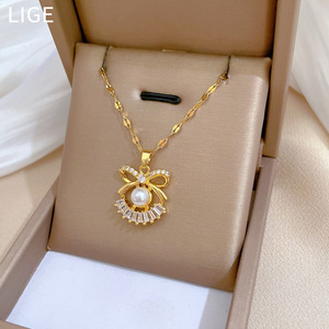 Bán Buôn Ánh Sáng Sang Trọng Kim Cương Ngọc Trai Bow 18K Vàng Mạ Vòng Cổ Bông Tai Set Thép Không Gỉ Đồ Trang Sức Thời Trang Cho Phụ Nữ - Product Image 3